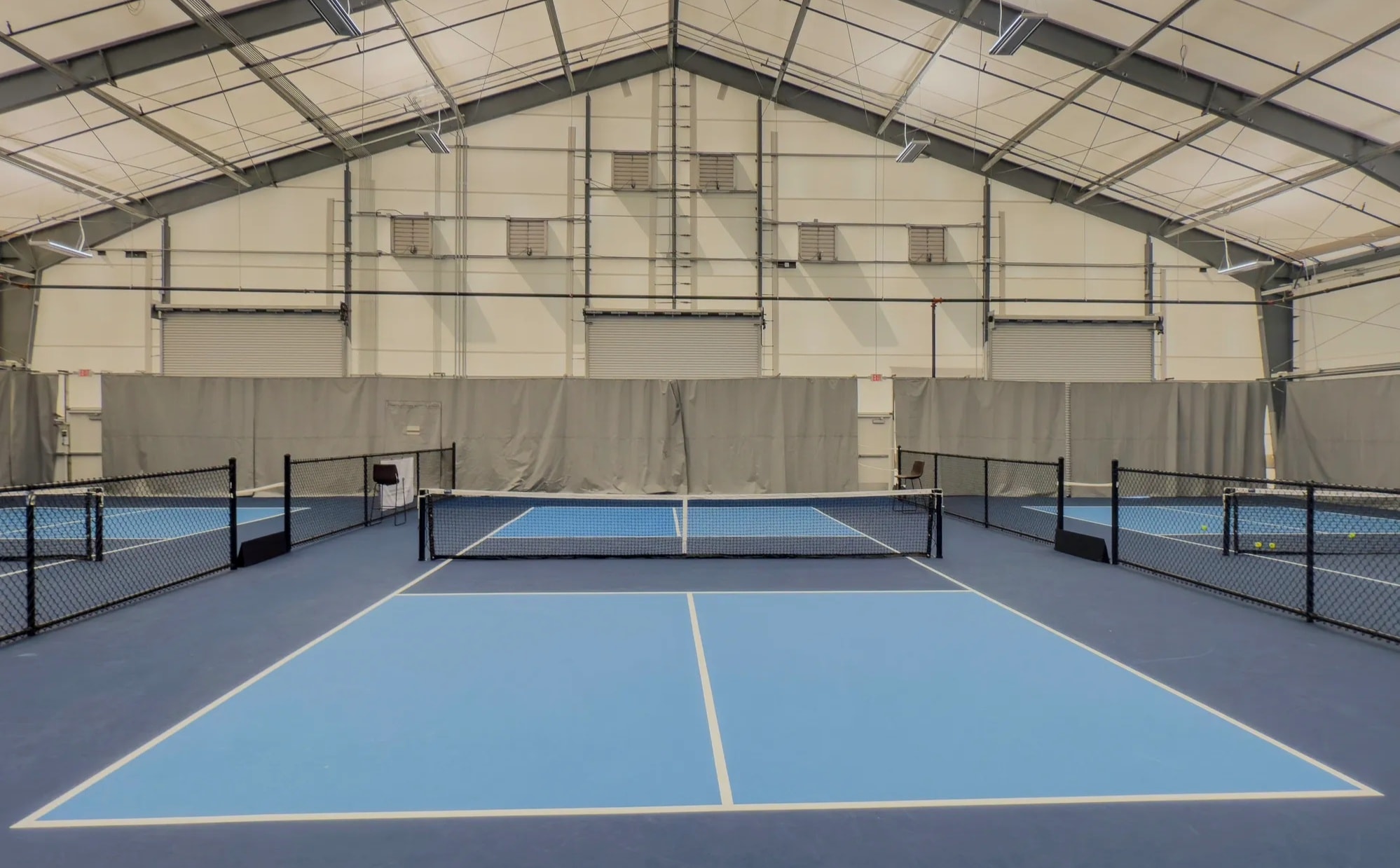 Pickleball facility with bright indoor courts